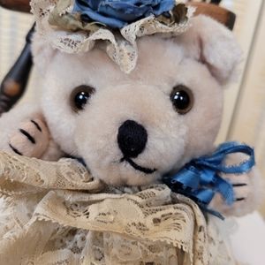 Vintage teddy bear in a lace dress